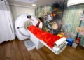 Patient undergoing CT Scan in Gurugram at a modern diagnostic lab with technician operating the scanning machine