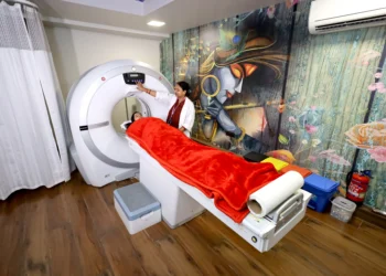 Patient undergoing CT Scan in Gurugram at a modern diagnostic lab with technician operating the scanning machine
