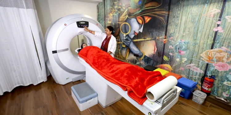 Patient undergoing CT Scan in Gurugram at a modern diagnostic lab with technician operating the scanning machine